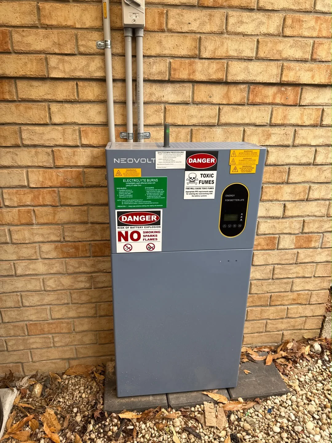 Neovolt battery system installed on a brick wall
