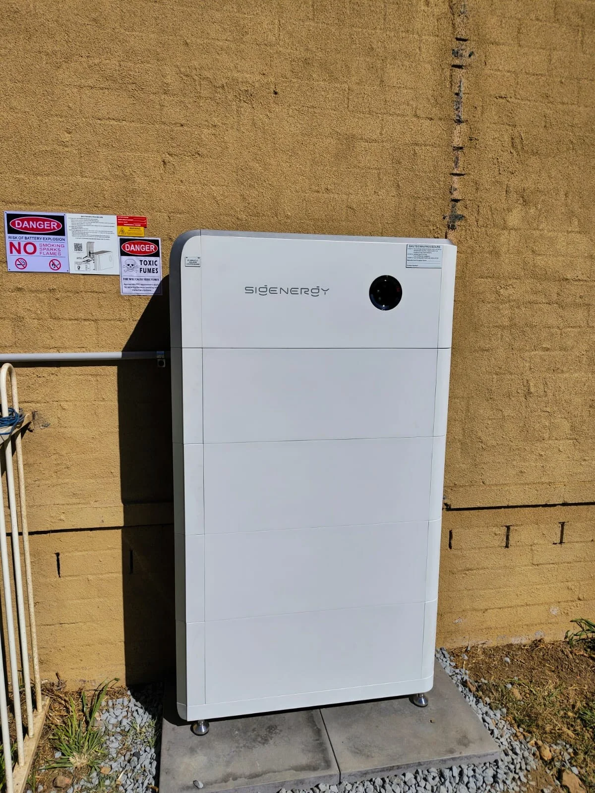 Sigenergy battery system installed against an exterior wall