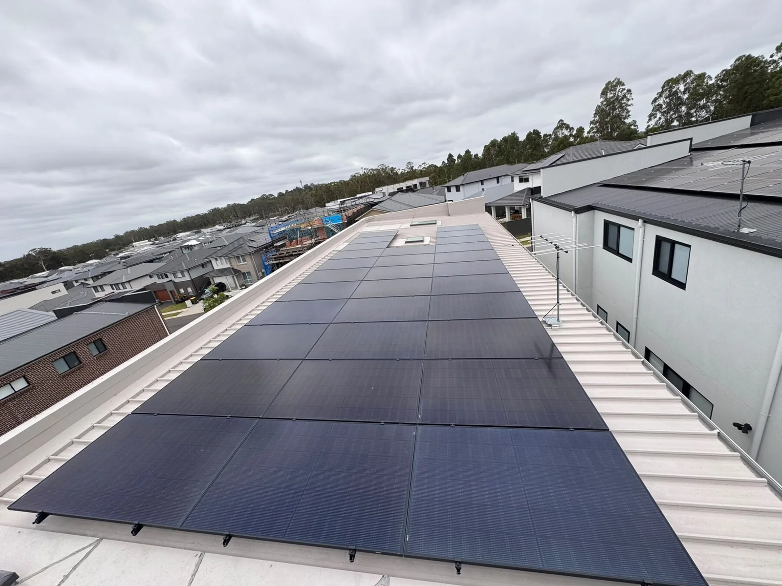 Solar panel array installed on a metal rooftop